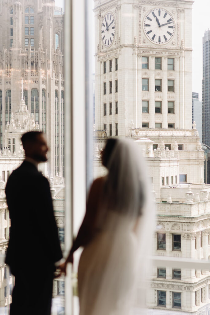 Wedding couple overlooks Chicago skyline. | Gabys Films