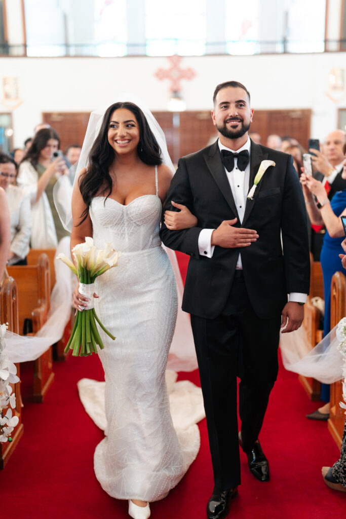 Smiling bride and groom walking. | Gabys Films