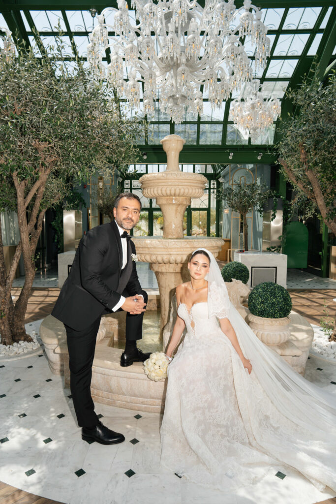 Couple posing by garden fountain. | Gabys Films