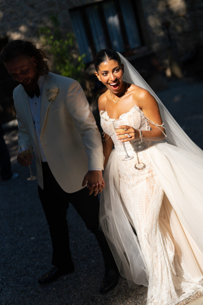 Bride and groom holding hands. | Gabys Films