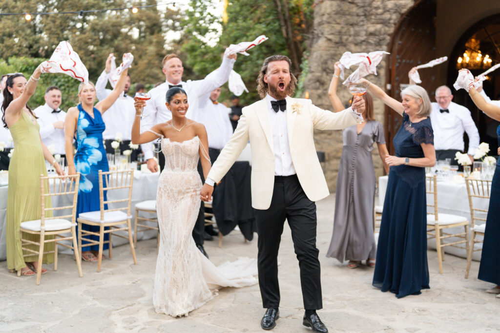 Wedding couple celebrating with guests. | Gabys Films