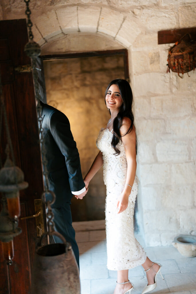 Couple holding hands near doorway. | Gabys Films
