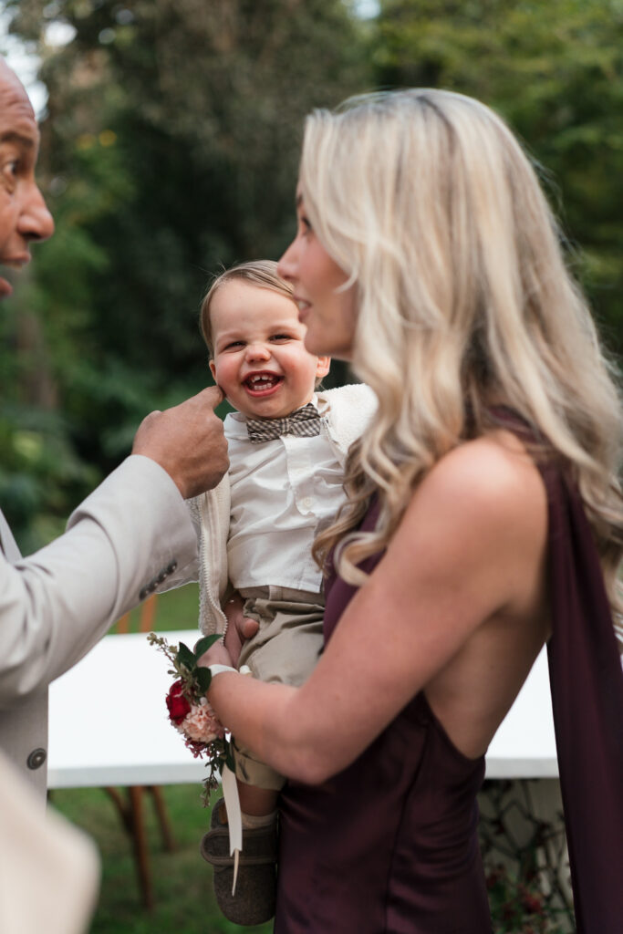 Woman holding happy young boy. | Gabys Films