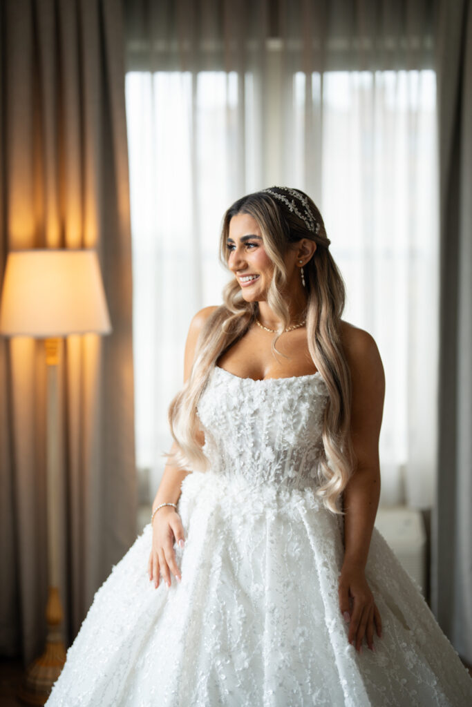 Smiling bride in white gown. | Gabys Films