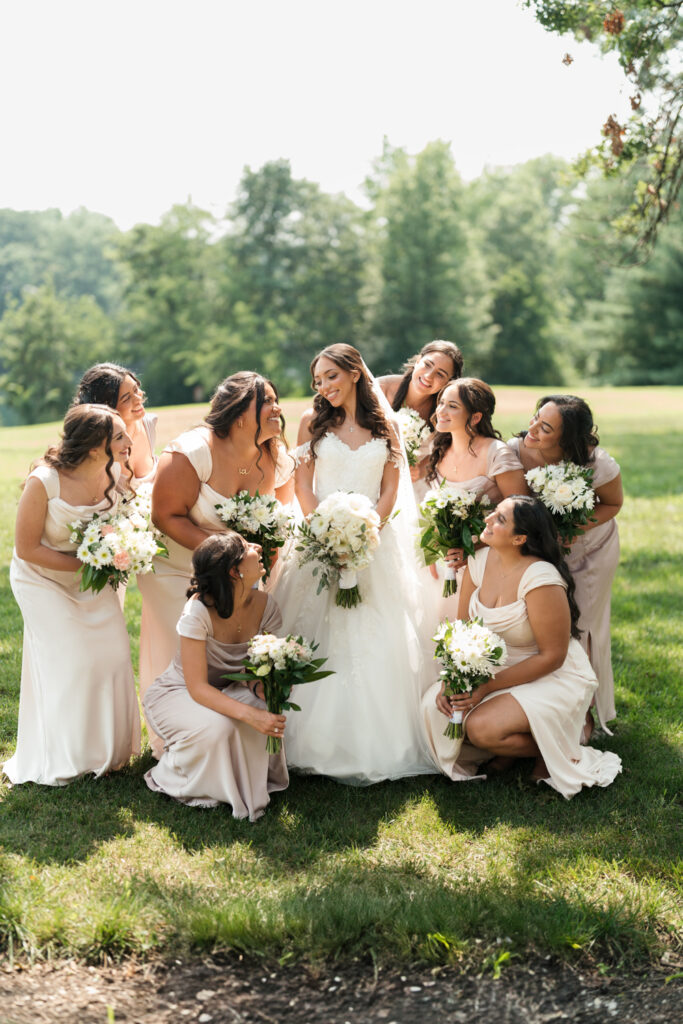 Bride and bridesmaids holding bouquets. | Gabys Films